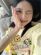 Creamy Cartoon Dog Graphic Tee - kawaii-inspired outfit in pastel colors - 74673263